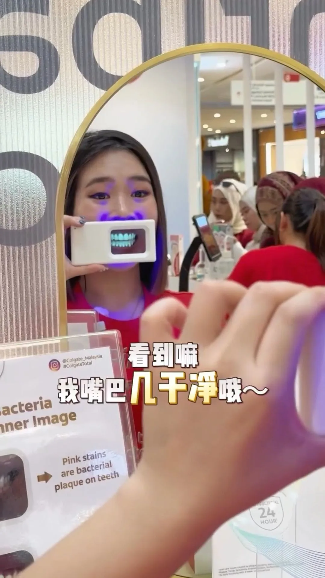 Person holding a plaque-light viewer displaying teeth, image 20
