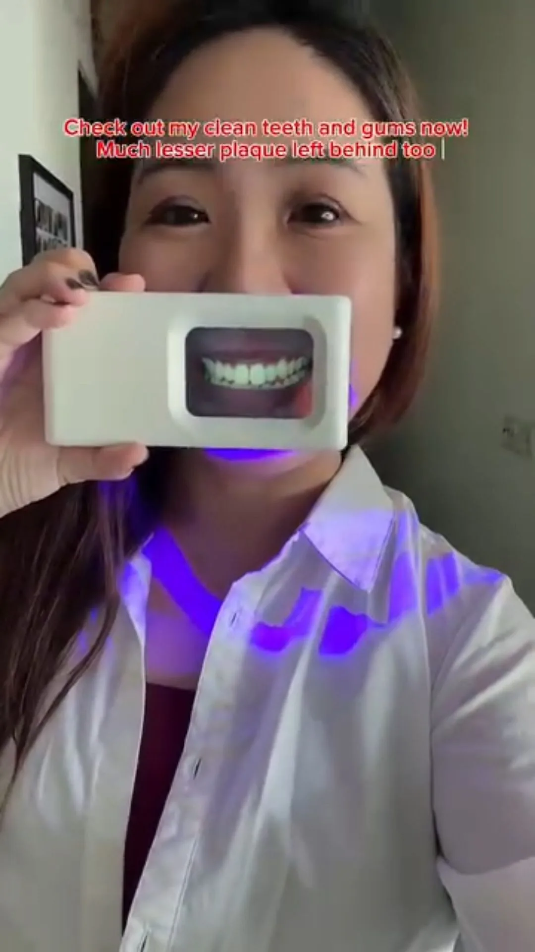 Person under violet illumination during a plaque-light demonstration, image 21