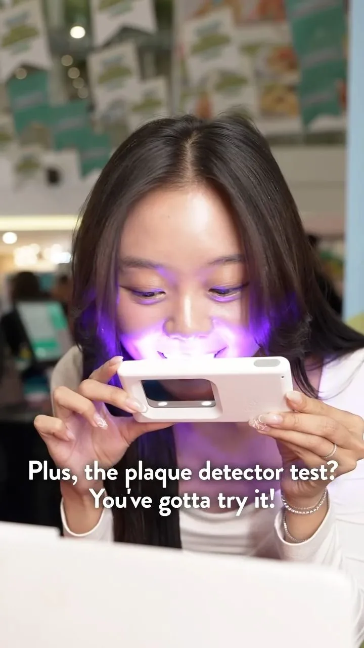 Person under violet illumination during a plaque-light demonstration, image 33