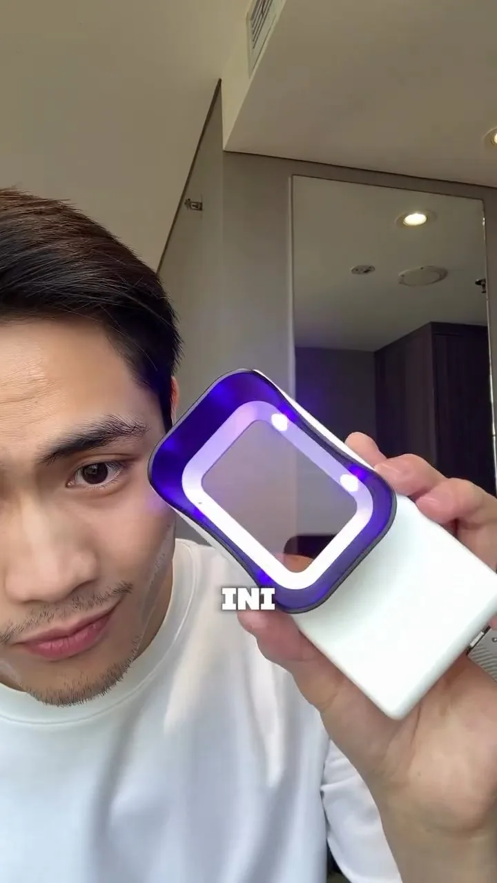 Handheld plaque-light viewer shown with its violet light, image 39